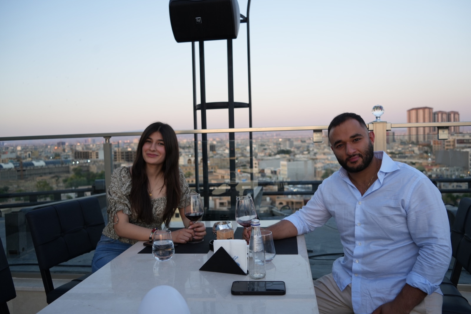 Ninos and Ashurena on a rooftop in Erbil at dusk
